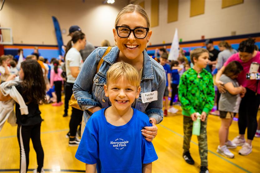 Students and families participate in a fun run